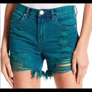 BlankNCY distressed teal shorts.